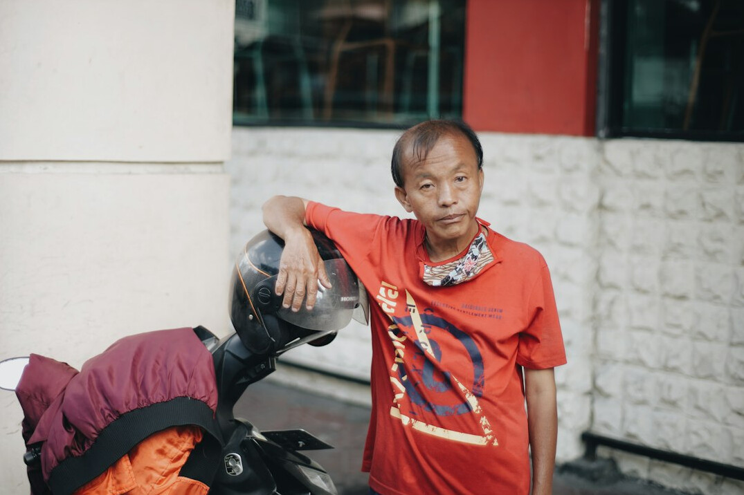 Photographer interviewing an elderly woman in a Polish village