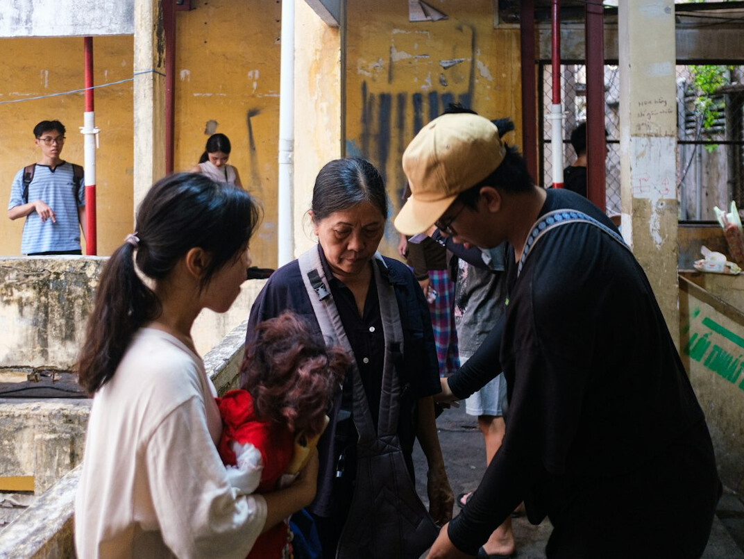 Photographer conducting a documentary session with a local family