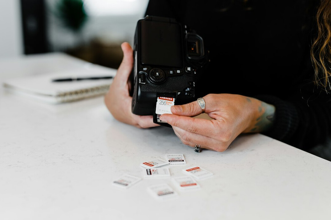 Photographer reviewing film negatives on a light table