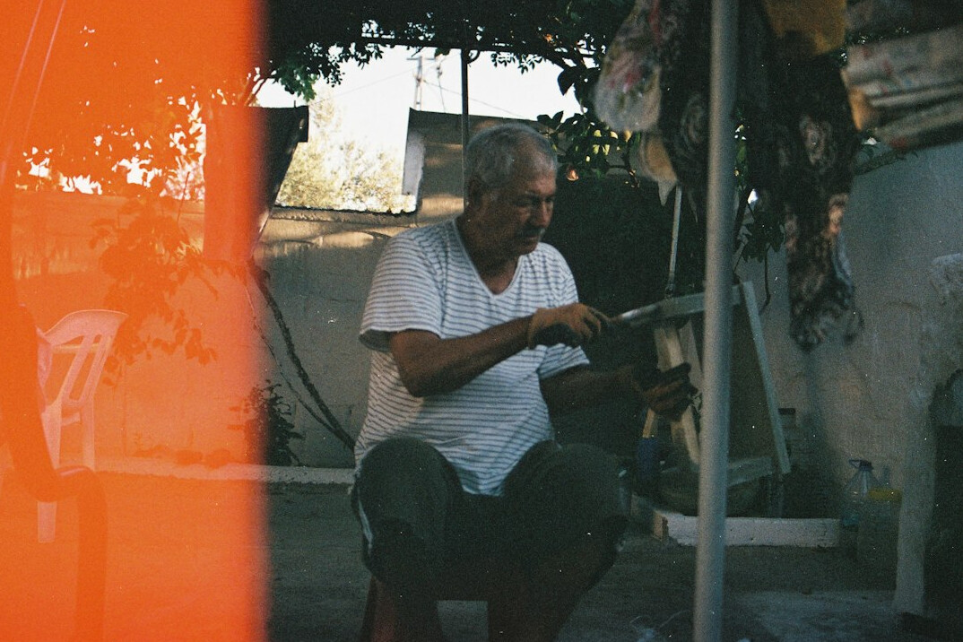 Elderly Polish craftsman working in a small village workshop